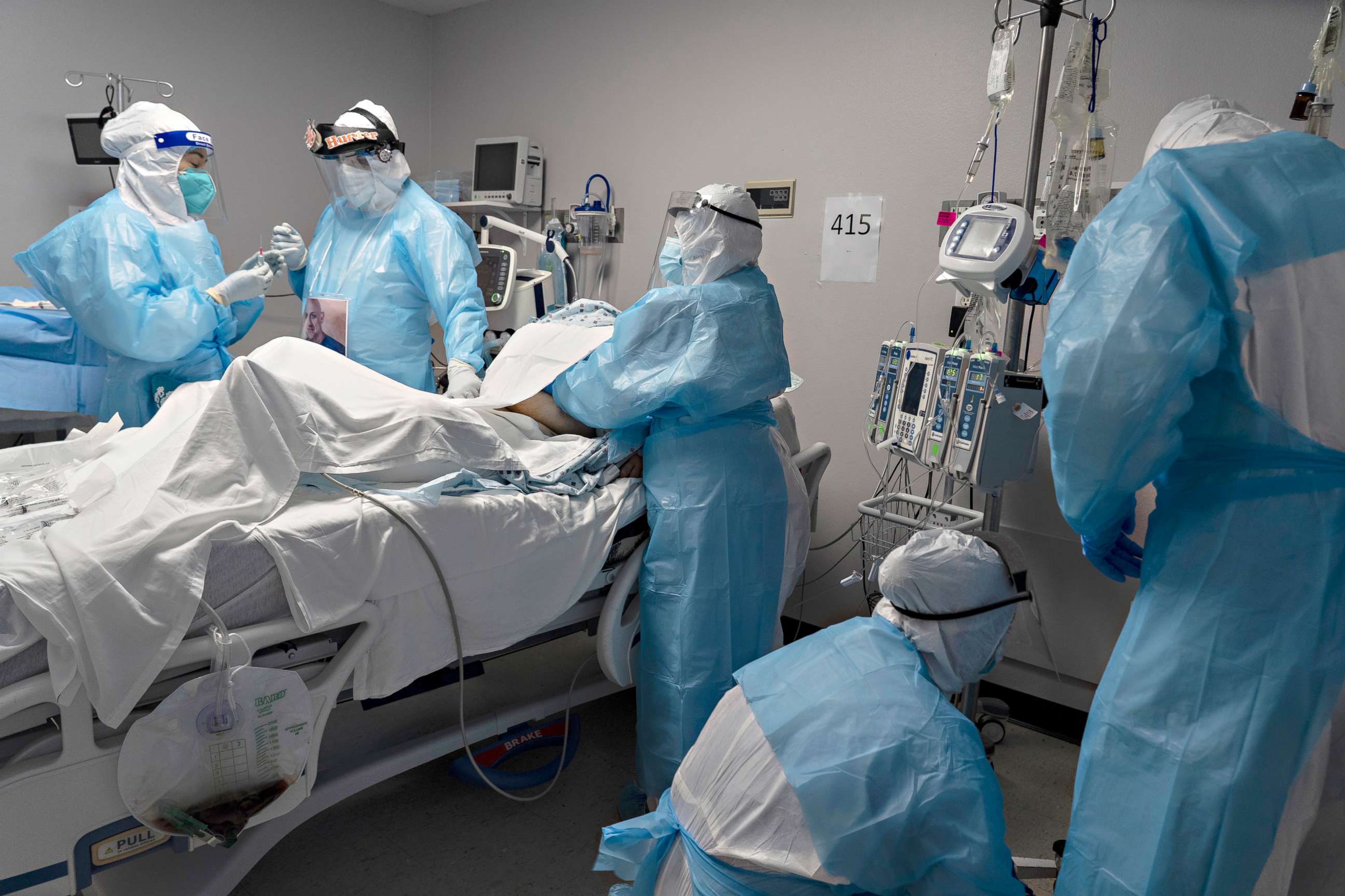 PHOTO: Medical staff members treat a patient in the COVID-19 intensive care unit (ICU) at the United Memorial Medical Center in Houston, Oct. 31, 2020.