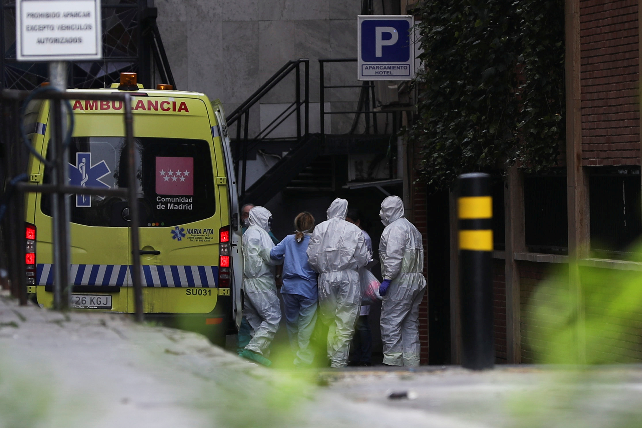 PHOTO: A patient arrives by ambulance at a hotel that has been set up to treat non-critical coronavirus patients during the coronavirus disease (COVID-19) health emergency in Madrid, March 19, 2020. 