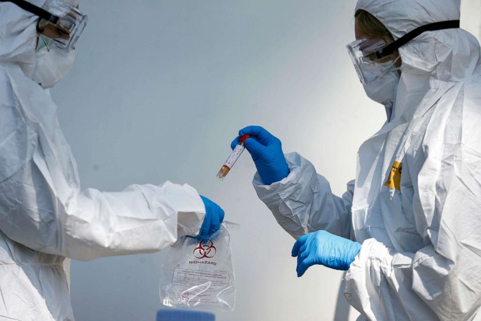 PHOTO: Medical staff of a mobile unit take samples to test for Covid-19, at the Santa Maria della Pieta' hospital complex, in Rome, April 1, 2020.