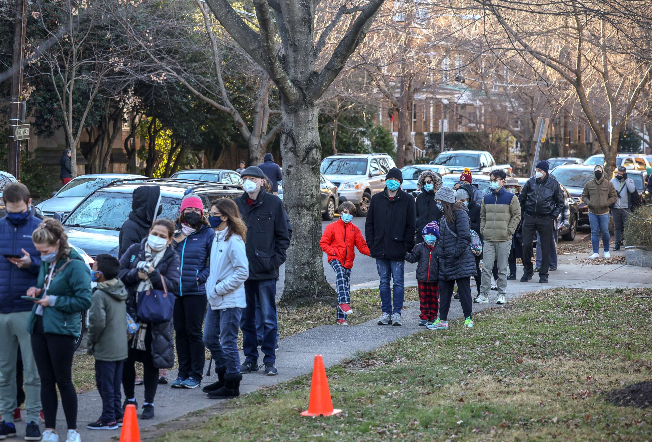 PHOTO: People wait in long lines to take a free COVID-19 test at a local fire station in Washington, D.C., Dec. 20, 2021.