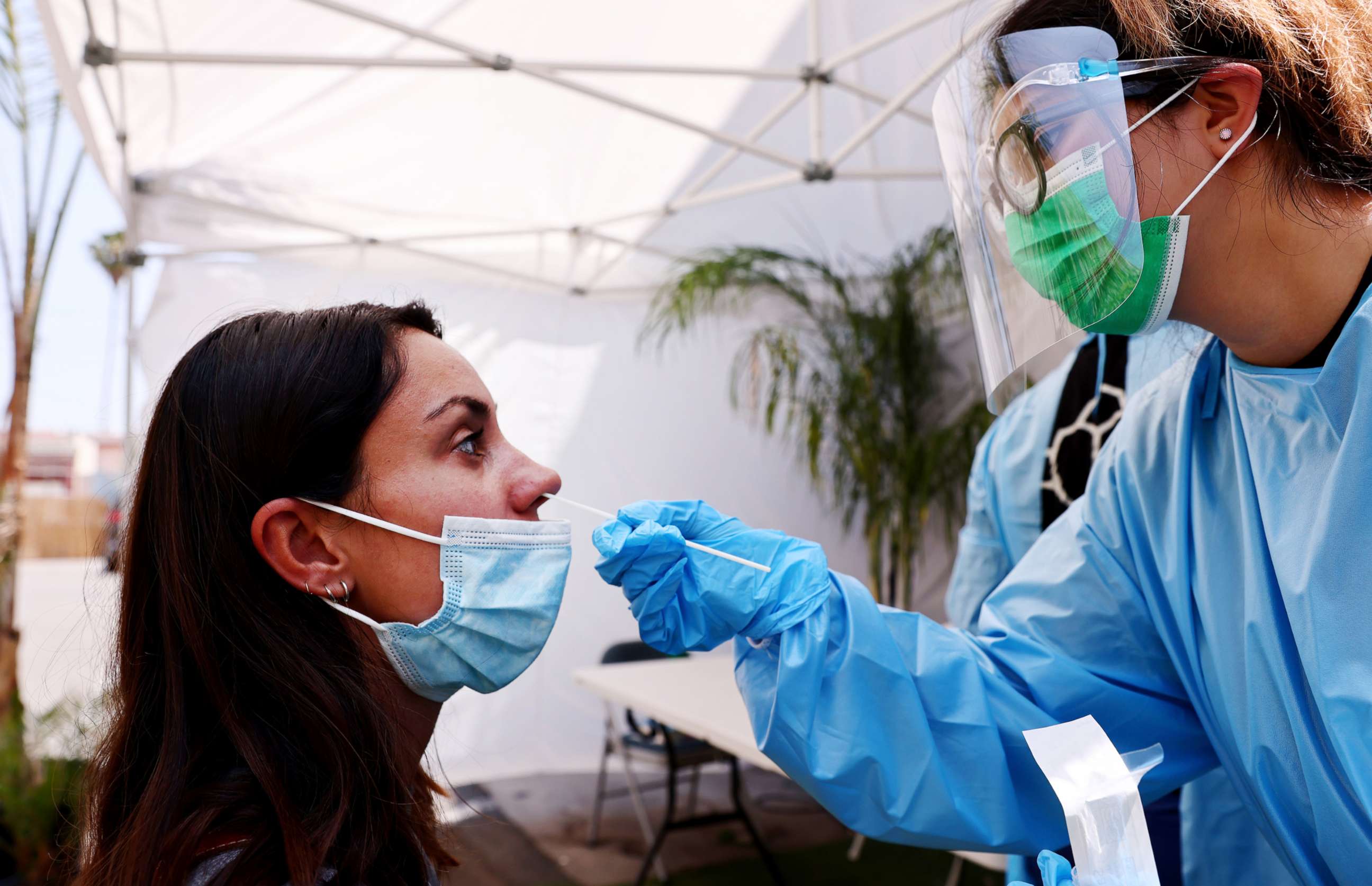 PHOTO: A registered nurse administers a COVID-19 test to a person at Sameday Testing on July 14, 2021, in Los Angeles.