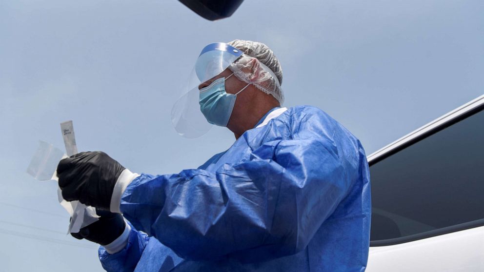 PHOTO: Floyd Talley prepares to administer a COVID-19 test at Floyd's Family Pharmacy as cases of the coronavirus disease (COVID-19) surge in Ponchatoula, Louisiana, Aug. 5, 2021.