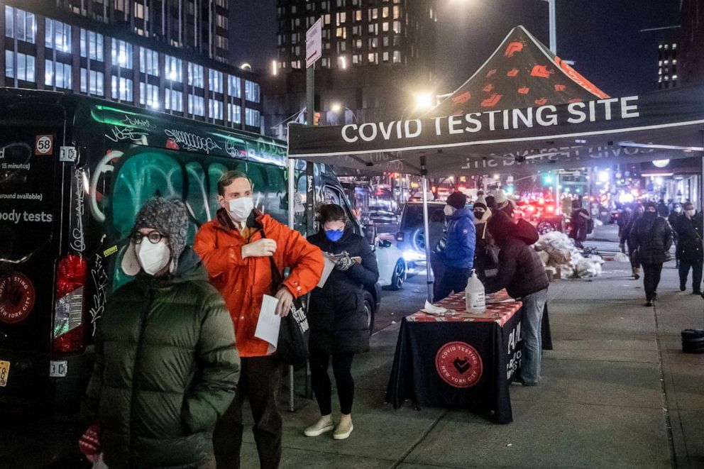 PHOTO: People wait on line to get tested for COVID-19 on Dec. 21, 2021, in New York. 