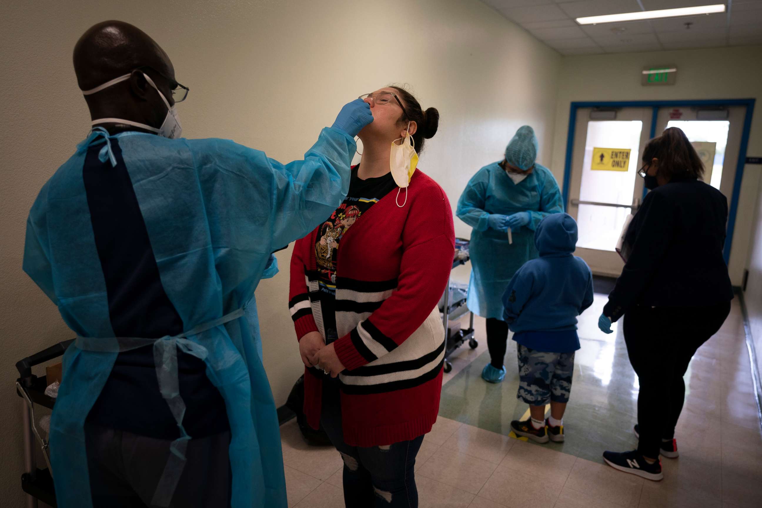 PHOTO: School employee Amanda Anguiano gets tested for COVID-19 on the first day of in-person learning at Maurice Sendak Elementary School in Los Angeles, April 13, 2021.