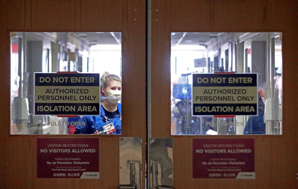 PHOTO: Doors to a COVID-19 treatment unit at UW Health in Madison, Wis. caution hospital personnel and visitors, Nov. 5, 2020.