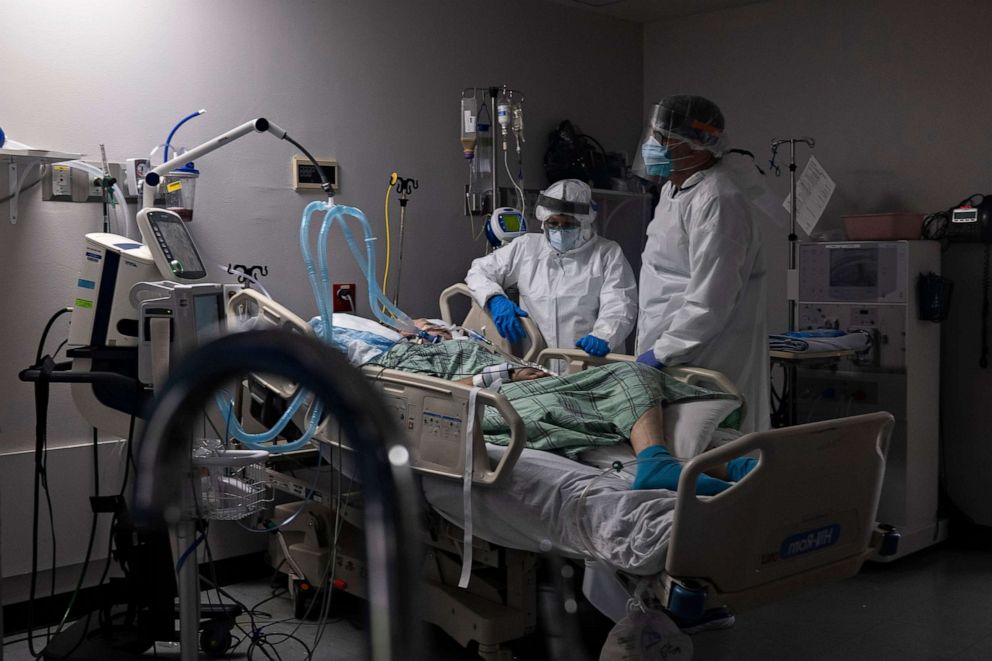 PHOTO: Members of the medical staff treat a patient in the COVID-19 intensive care unit at the United Memorial Medical Center on July 28, 2020.