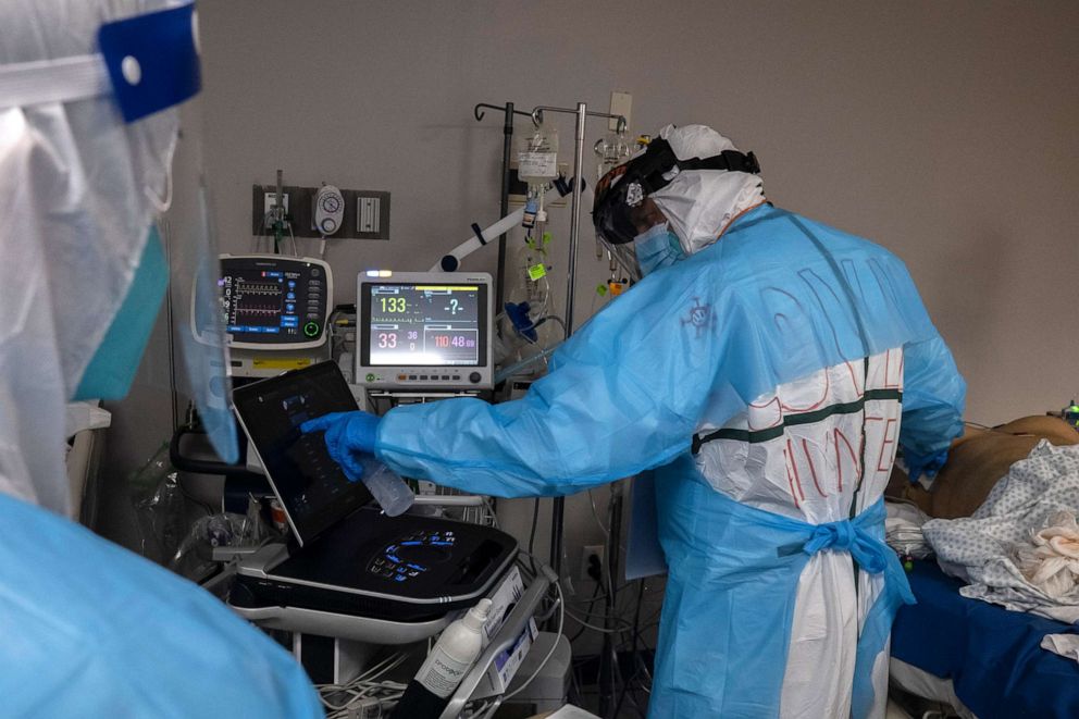 PHOTO: Medical staff members treat a patient suffering from the coronavirus disease (COVID-19) in the COVID-19 intensive care unit (ICU) at the United Memorial Medical Center, Nov. 14, 2020, in Houston, Texas.