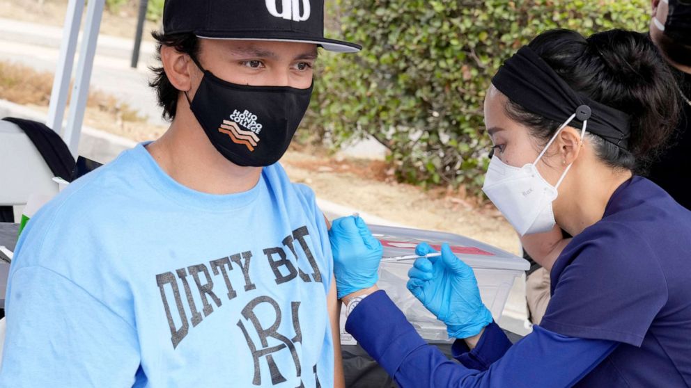 PHOTO: A nurse gives the Pfizer vaccine to a student during a Coronavirus vaccination clinic at Rio Hondo College in Whittier, Calif., ​Sept. 1, 2021.
