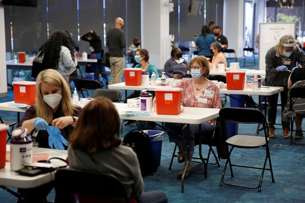 PHOTO: Ravenswood Family Health Center staff and volunteers give coronavirus disease (COVID-19) vaccines at a newly opened vaccination site at Facebook headquarters in Menlo Park, Calif., April 10, 2021.