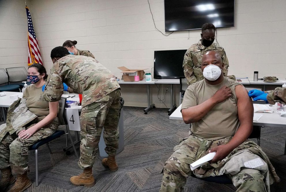 PHOTO: Members of the Mississippi Air and Army National Guard Guard receive the first dose of the Moderna COVID-19 vaccine in Flowood, Miss., Dec. 23, 2020.