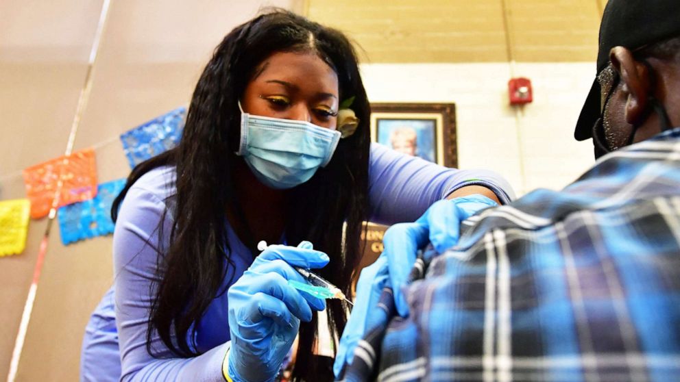 PHOTO: A nurse administers the Pfizer booster shot at a COVID-19 vaccination and testing site in Los Angeles, on May 5, 2022.