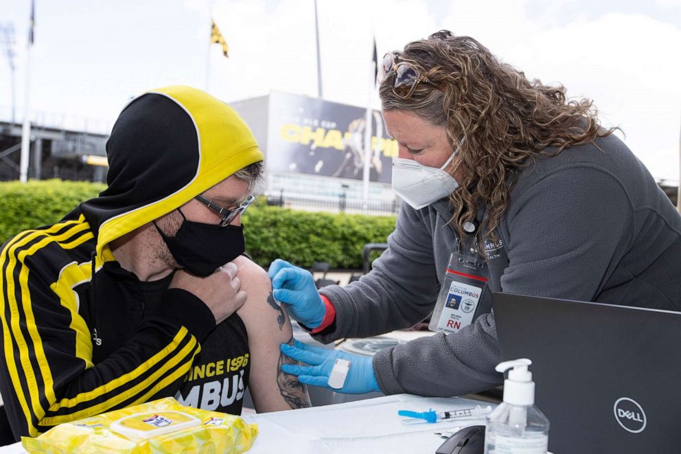 PHOTO: A fan receives the Johnson & Johnson COVID-19 vaccine before a match against DC United at Crew Stadium, May 8, 2021 in Columbus, Ohio.