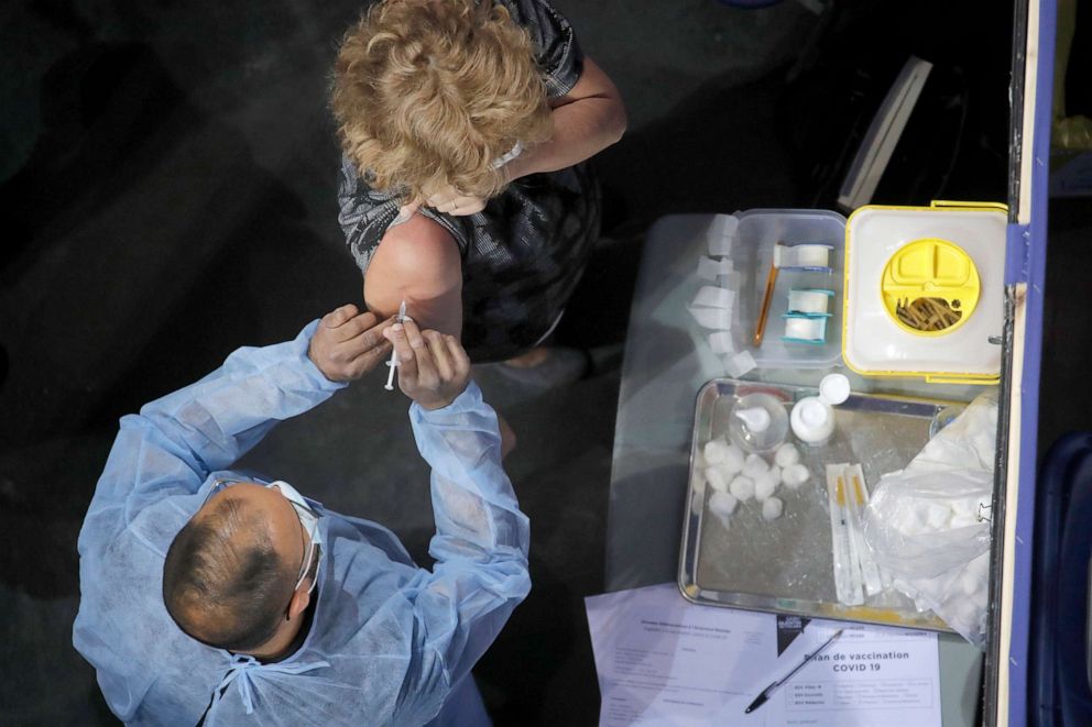 PHOTO: A woman receives Pfizer's COVID-19 vaccine at the National Velodrome in Saint-Quentin-en-Yvelines, west of Paris, March 29, 2021.