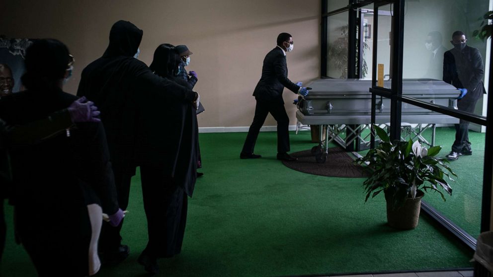 PHOTO: The remains of Courtney Clarke, 67, who died of COVID-19, are taken from Smith Funeral Home in Elizabeth, N.J., March 27, 2020. 