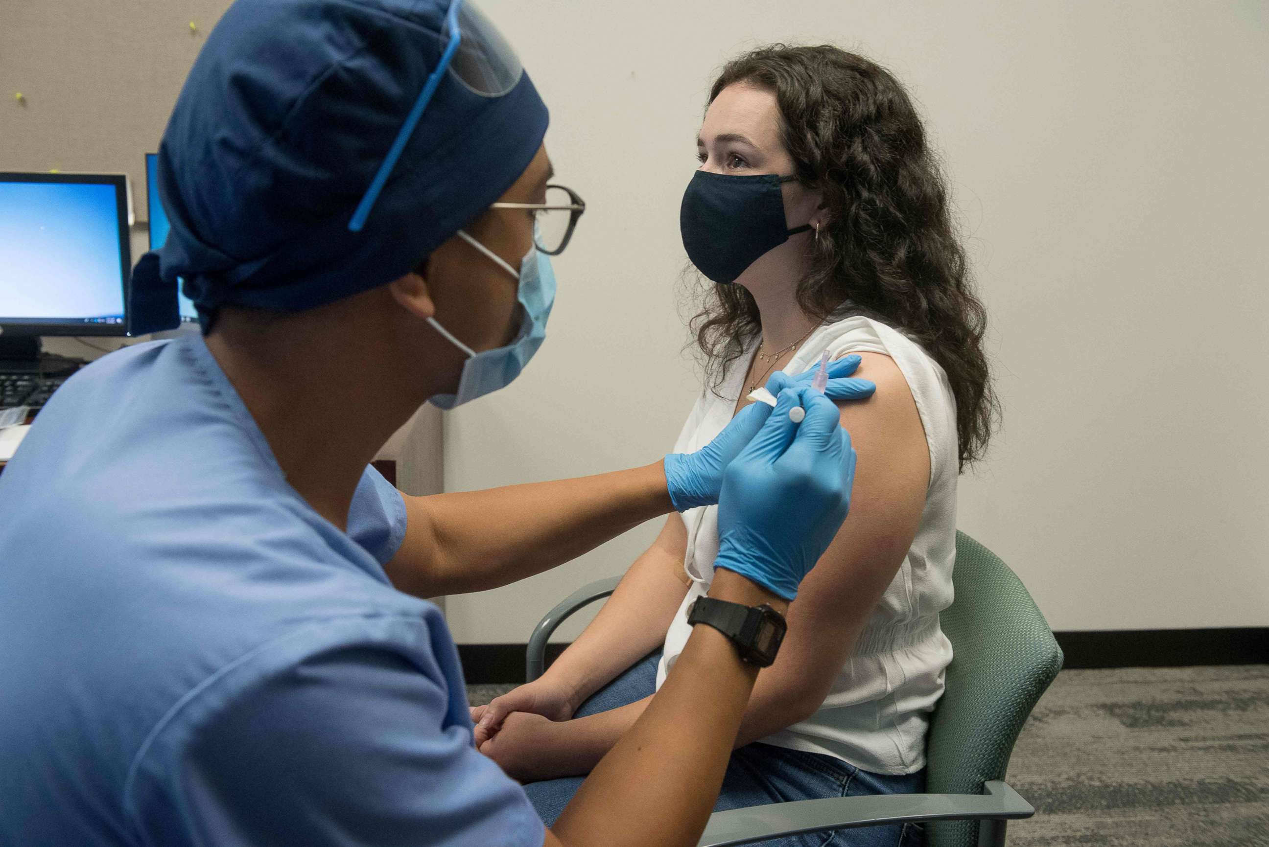 A volunteer is given a COVID-19 trial vaccine at the Henry Ford Health System in Detroit, Aug. 5, 2020