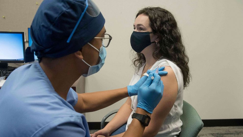 A volunteer is given a COVID-19 trial vaccine at the Henry Ford Health System in Detroit, Aug. 5, 2020