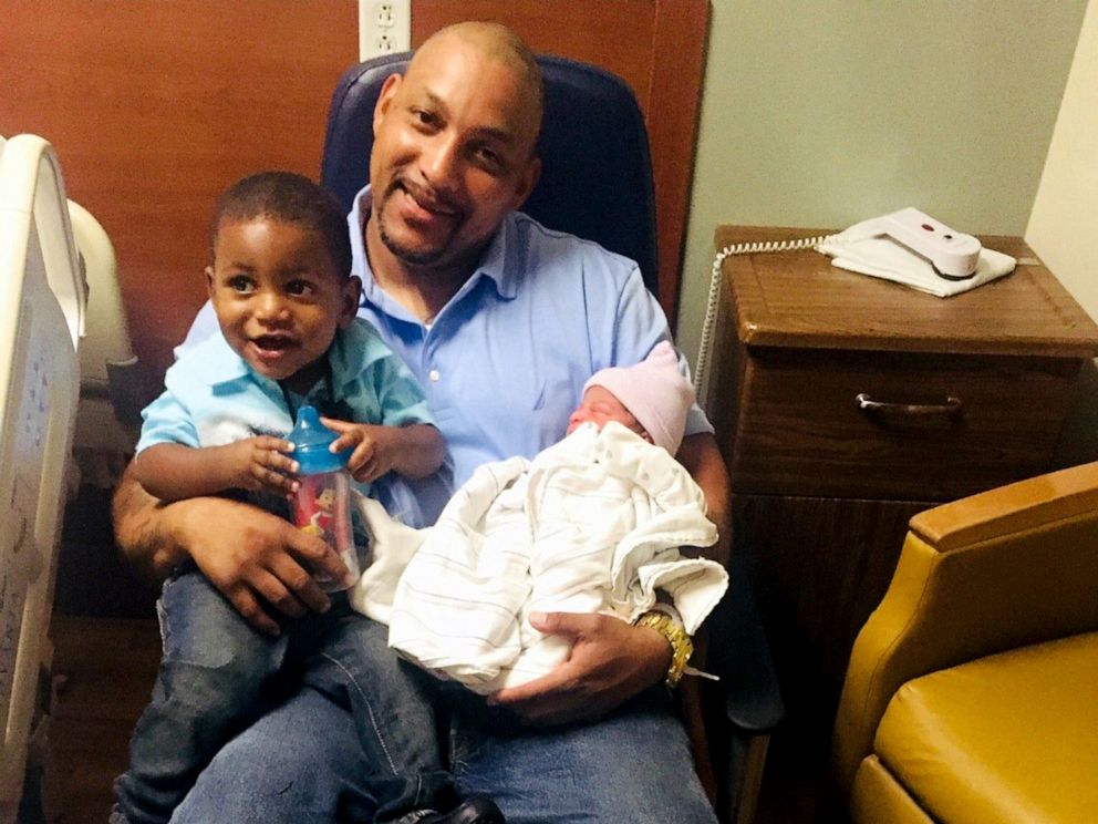 PHOTO: Craig Brewer, 41, poses with his 2-year-old son after the birth of his daughter in May 2018. Brewer, 41, was shot to death on April 7, 2019, at a Waffle House in Gainesville, Fla., after offering to buy meals for customers.