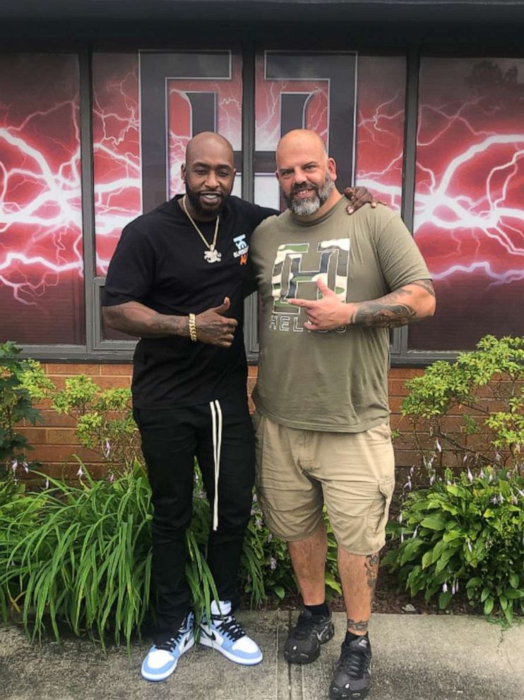 PHOTO: Craig Petralia, founder and CEO of Helios Tattoo Supply in New York, poses for a photo alongside Ceaser Emanuel of the hit television series "Black Ink Crew."
