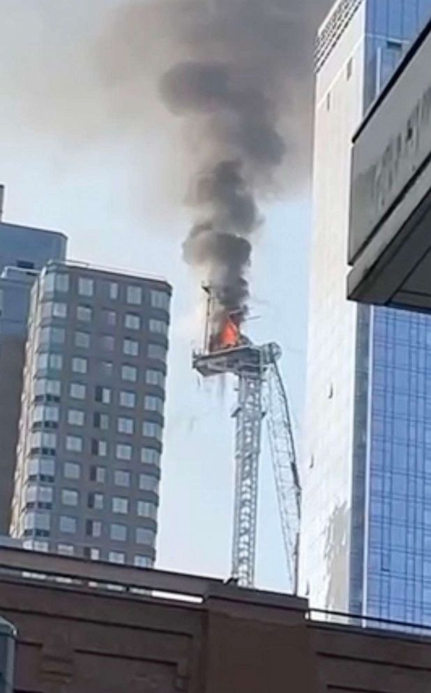 PHOTO: Smoke is visible after a construction crane caught fire on a high-rise building in Manhattan, New York City, July 26, 2023.