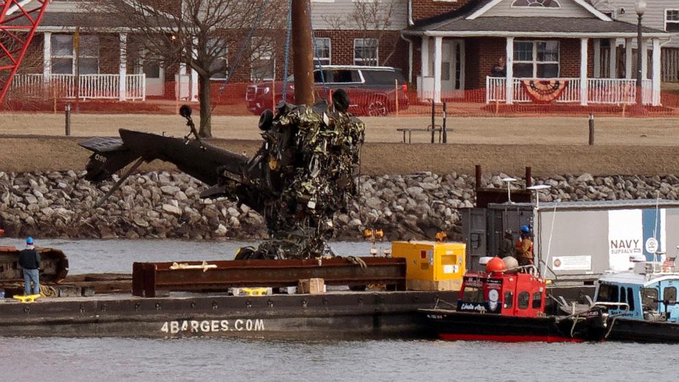 PHOTO: Rescue and salvage crews pull up a part of a Army Black Hawk helicopter that collided midair with an American Airlines jet, at a wreckage site in the Potomac River from Ronald Reagan Washington National Airport, Feb. 6, 2025, in Arlington, Va.