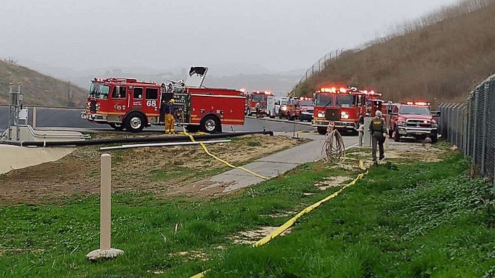 PHOTO: First responders on the scene of a helicopter crash in Calabasas, Calif., Jan. 26, 2020. 