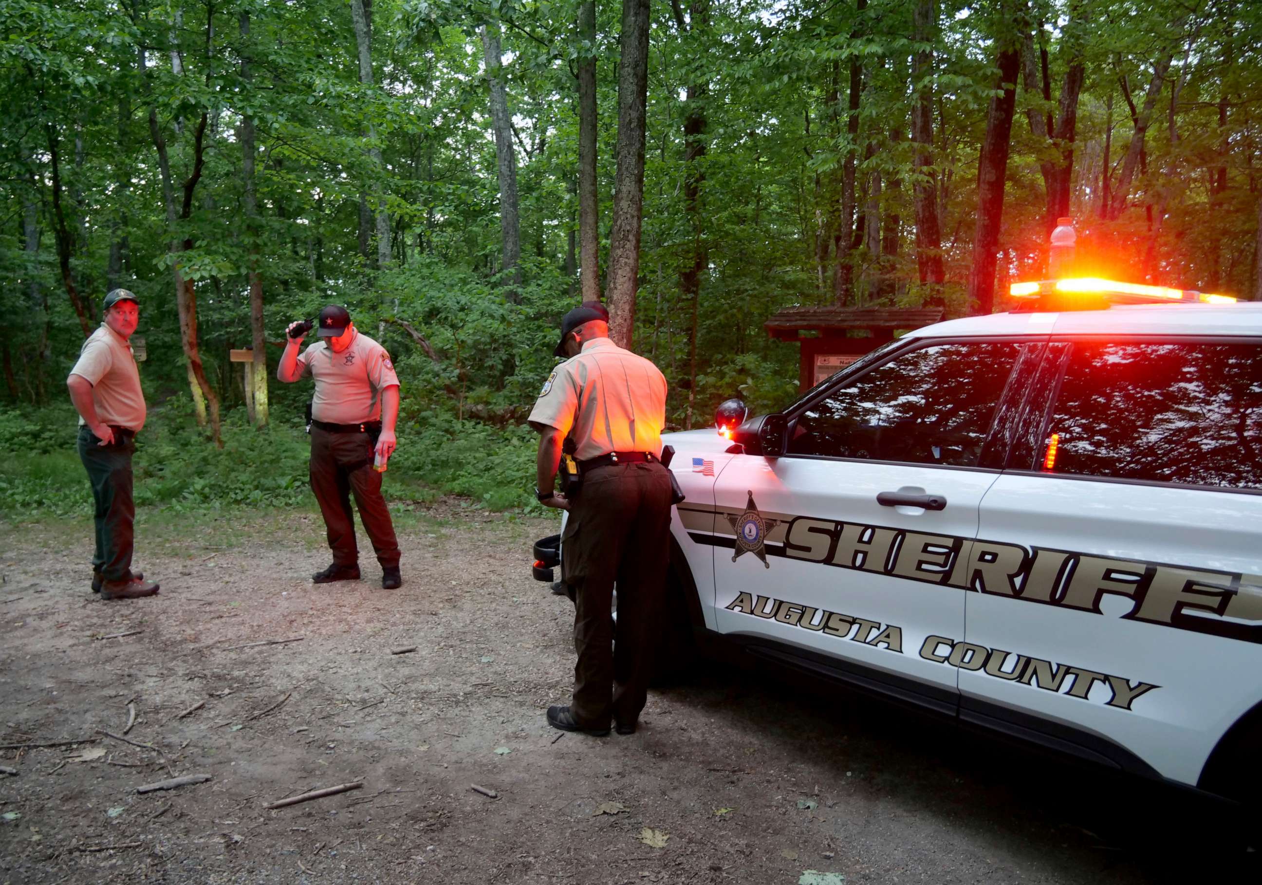 PHOTO: Authorities secure the entrance to Mine Bank Trail, an access point to the rescue operation along the Blue Ridge Parkway where a Cessna Citation crashed over mountainous terrain near Montebello, Va., Sunday, June 4, 2023