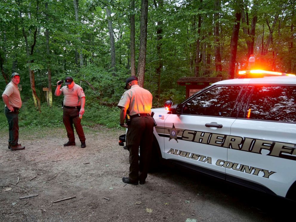 PHOTO: Authorities secure the entrance to Mine Bank Trail, an access point to the rescue operation along the Blue Ridge Parkway where a Cessna Citation crashed over mountainous terrain near Montebello, Va., Sunday, June 4, 2023