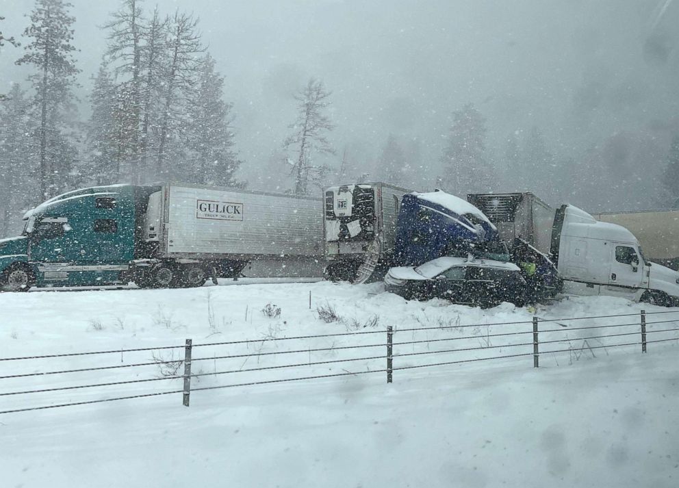 PHOTO: Trucks and cars sit in the snow following a crash along I-84 in the Meacham Pass area, Oregon, Feb. 21, 2022.