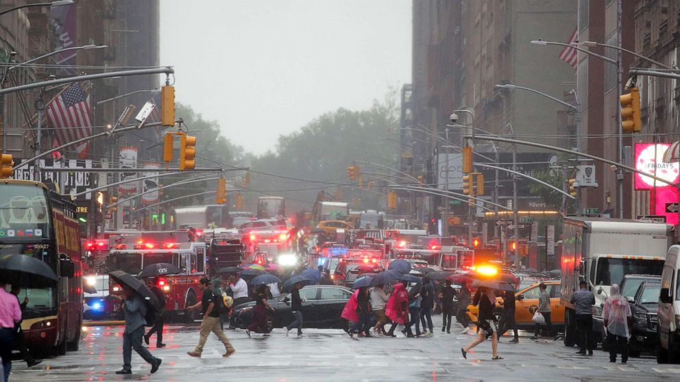 PHOTO: Emergency vehicles fill the street at the scene after a helicopter crashed atop a building in Times Square and caused a fire in the Manhattan borough of New York, June 11, 2019. 