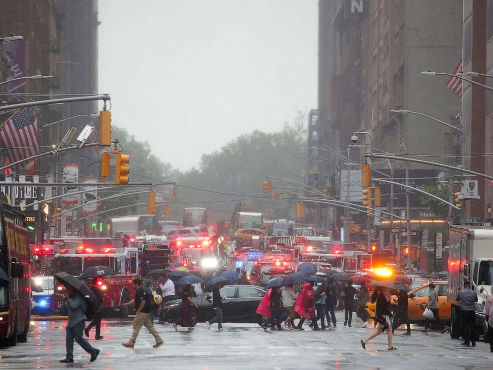 PHOTO: Emergency vehicles fill the street at the scene after a helicopter crashed atop a building in Times Square and caused a fire in the Manhattan borough of New York, June 11, 2019. 
