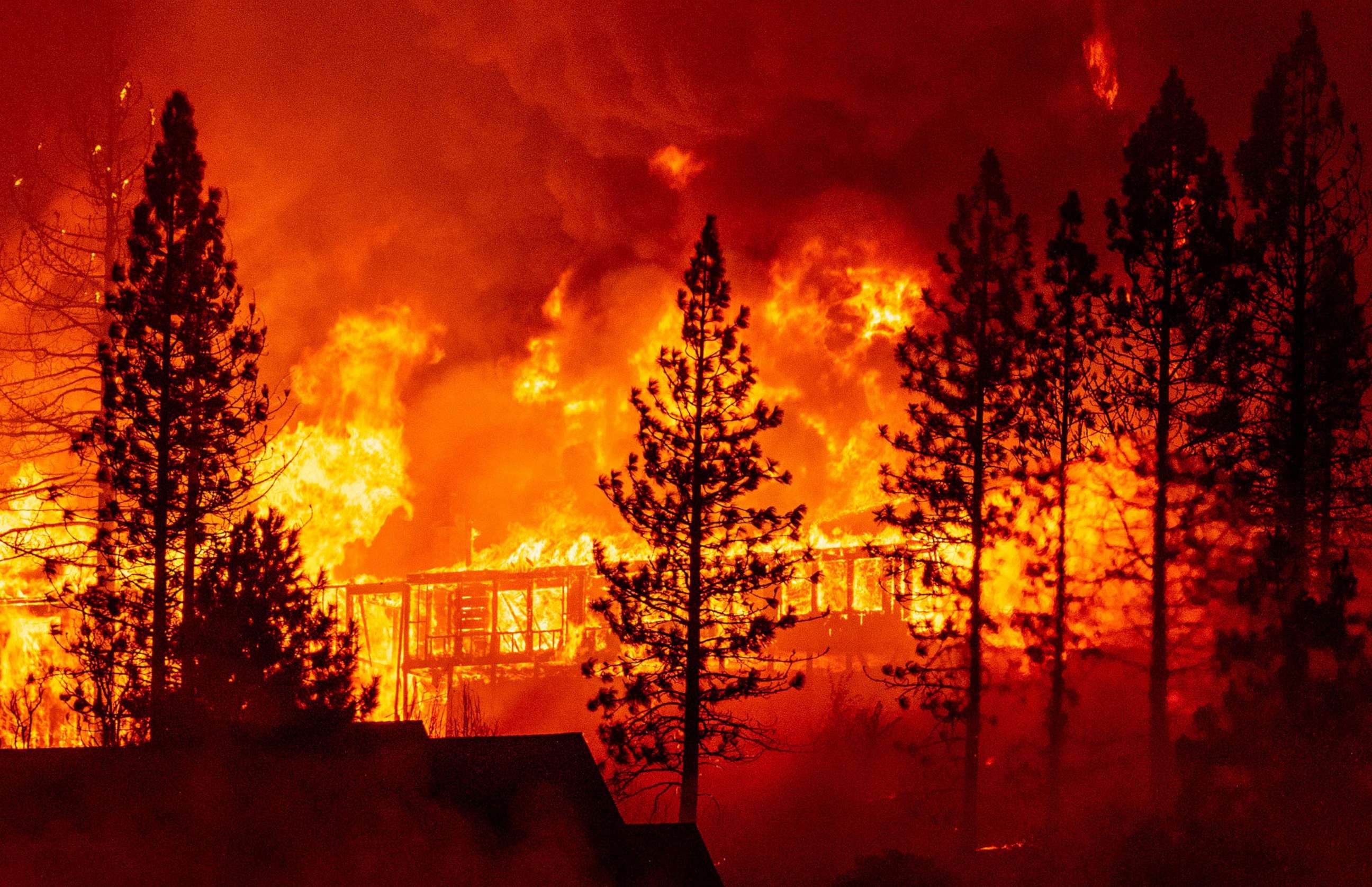 PHOTO: In this Sept. 8, 2020, file photo, a home is engulfed in flames during the "Creek Fire" in the Tollhouse area of unincorporated Fresno County, Calif.