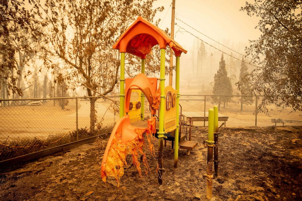 PHOTO: A melted slide smolders as a playground continues to burn at Pine Ridge school during the Creek fire in an unincorporated area of Fresno County, Calif., Sept. 08, 2020.