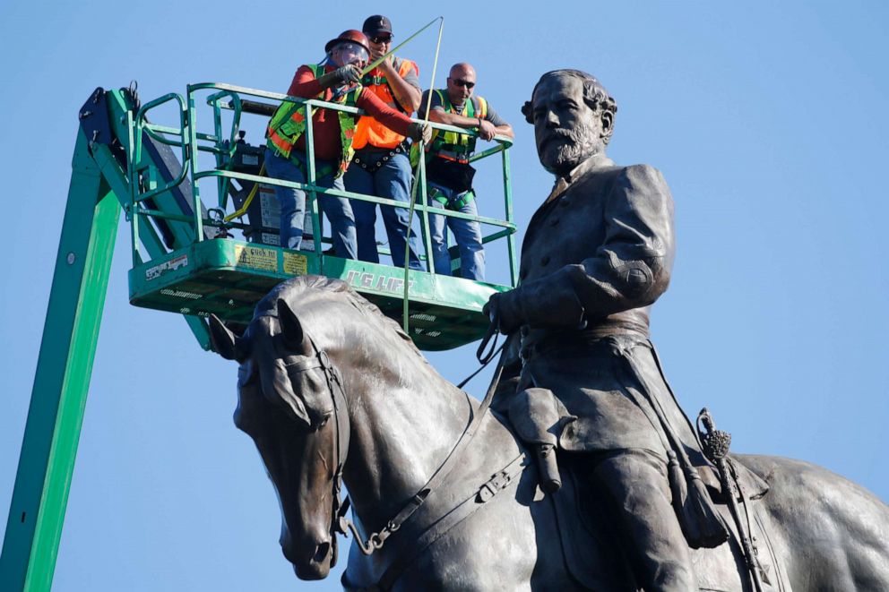 PHOTO: An inspection crew from the Virginia Department of General Services takes measurements as they inspect the statue of Confederate Gen. Robert E. Lee on Monument Avenue in Richmond, Virginia, on June 8, 2020.