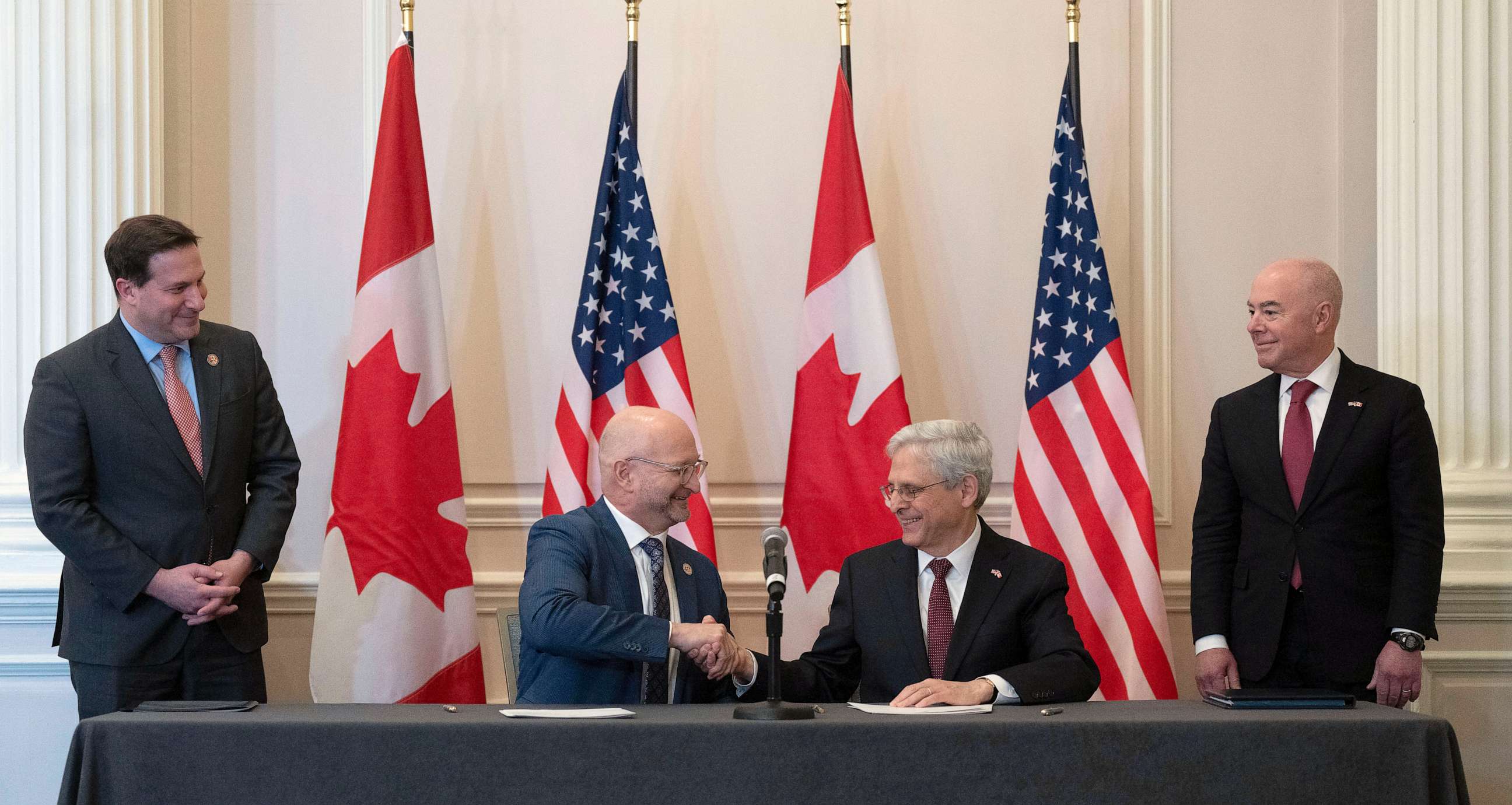 PHOTO: Minister of Justice and Attorney General of Canada David Lametti and U.S. Attorney General Merrick Garland shake hands after signing a document following the 2023 Canada-United States Cross-Border Crime Forum, Apr. 28, 2023 in Ottawa, Ontario.