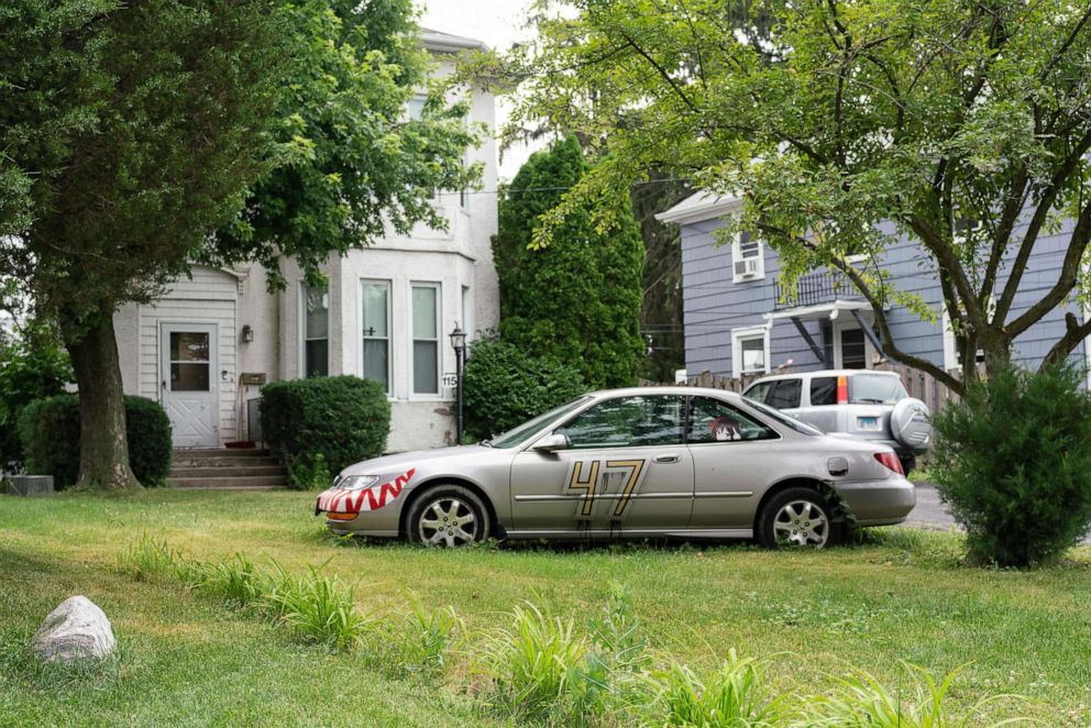 PHOTO: A car with decals is parked outside of the house where Robert Crimo III, a person of interest in the July 4th parade shooting, lives in the Chicago suburb of Highwood, Ill., on July 5, 2022.