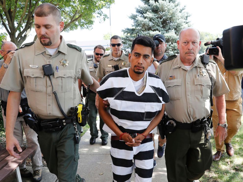 PHOTO: Cristhian Rivera is escorted into the Poweshiek County Courthouse for his initial court appearance, Aug. 22, 2018, in Montezuma, Iowa.