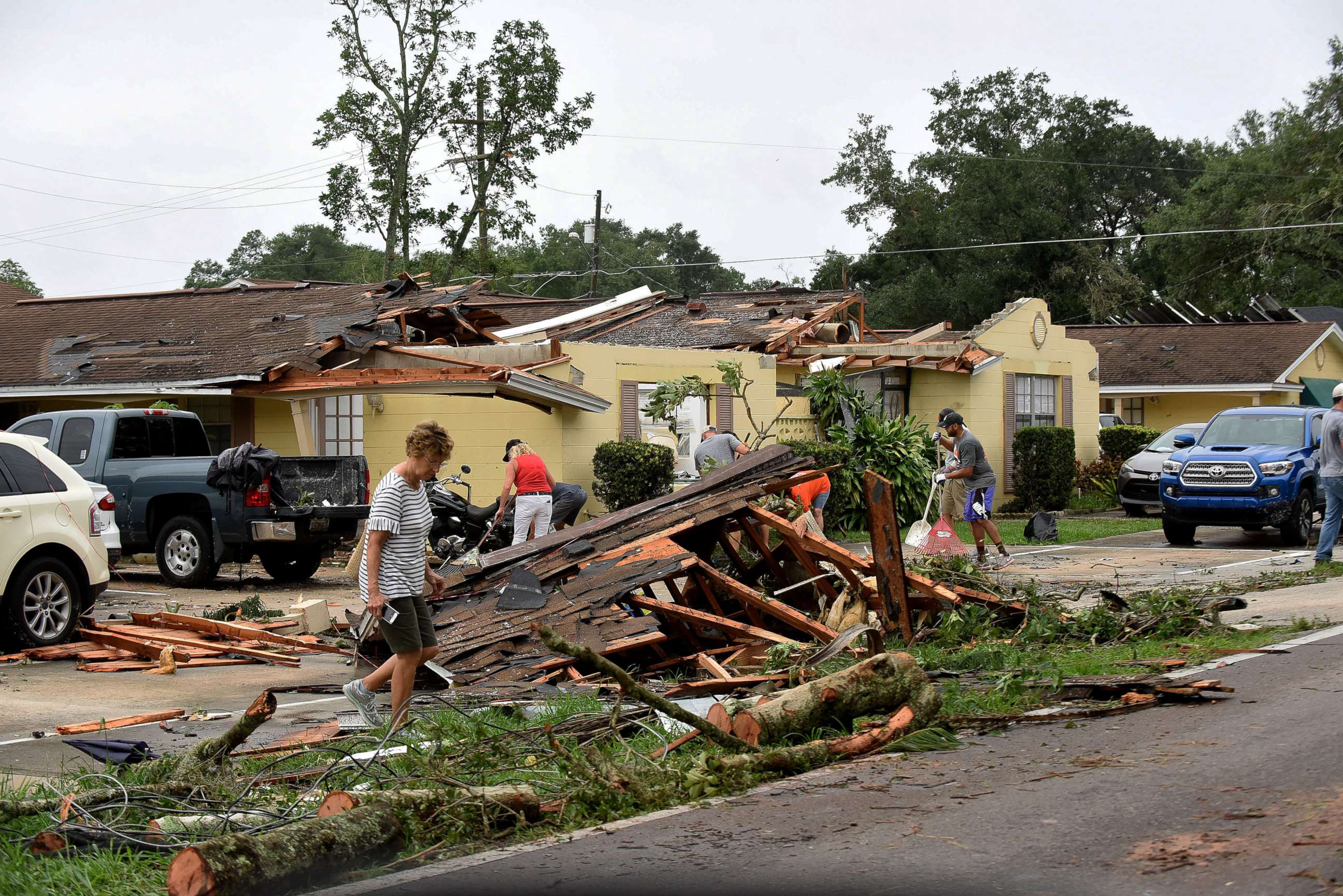 PHOTO: People clean up debris from their damaged apartments during the aftermath of a tornado spawned by Tropical Storm Cristobal passed through Orlando, Florida, June 7, 2020.