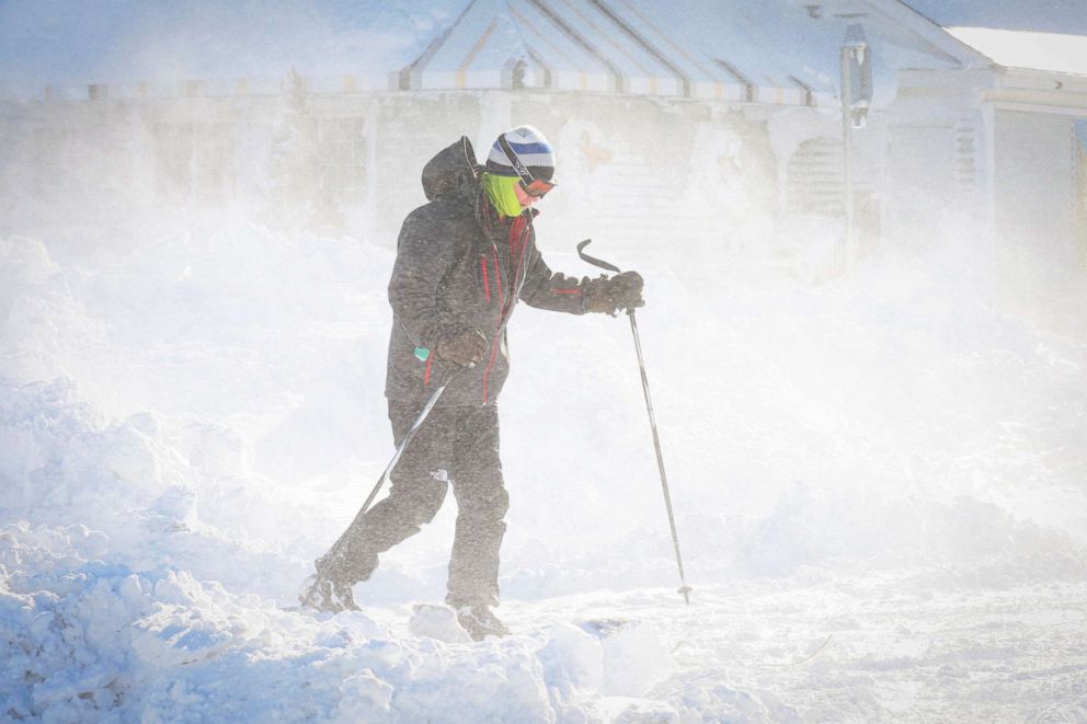 PHOTO: A man skis following a winter storm that hit the Buffalo region on Main Street in Amherst, N.Y., Dec. 25, 2022.
