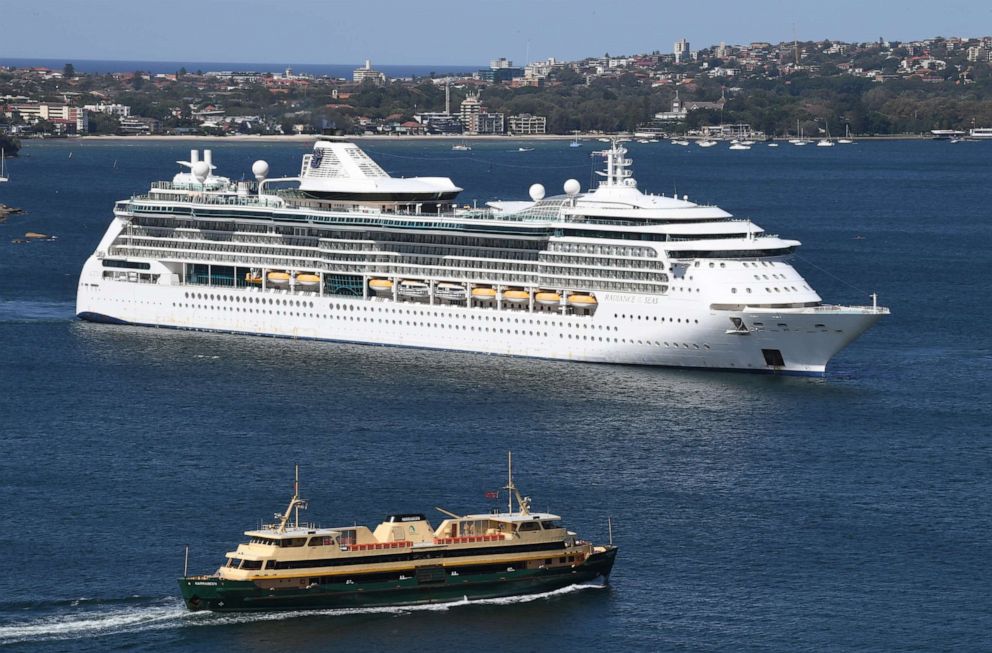 PHOTO: Royal Caribbean's cruise ship, Radiance of the Seas is escorted by Australian Border Vessels and Maritime Police as it departs Sydney Harbour on April 04, 2020 in Sydney, Australia.