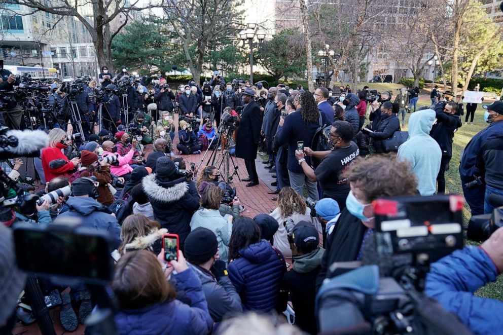 PHOTO: George Floyd family attorney Ben Crump, center, addresses media along with other attorneys and members of George Floyd's family outside the Hennepin County Government Center, March 29, 2021, in Minneapolis.