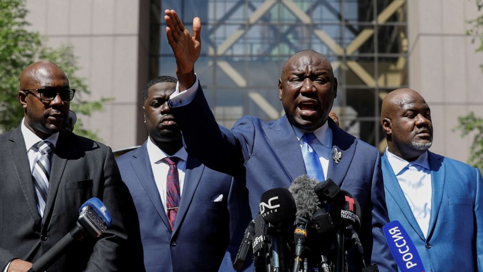 PHOTO: Lawyer Ben Crump, sorrounded by members of George Floyd's family, gestures as he talks to the media after the sentence on former police officer Derek Chauvin, who was convicted for murdering George Floyd, in Minneapolis, June 25, 2021.