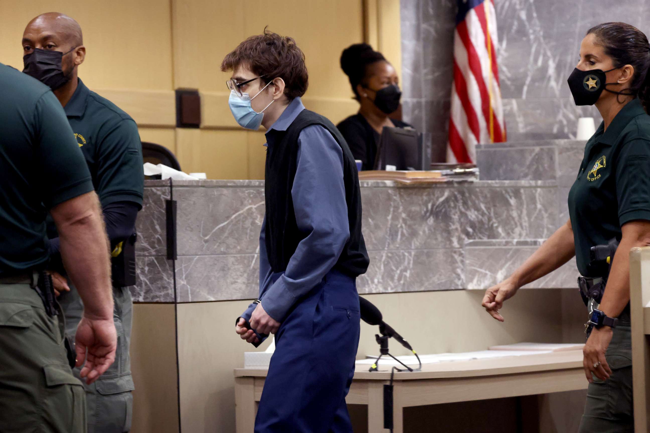 PHOTO: Marjory Stoneman Douglas High School shooter Nikolas Cruz crosses the courtroom in handcuffs, Oct. 20, 2021, at the Broward County Courthouse in Fort Lauderdale, Fla. 
