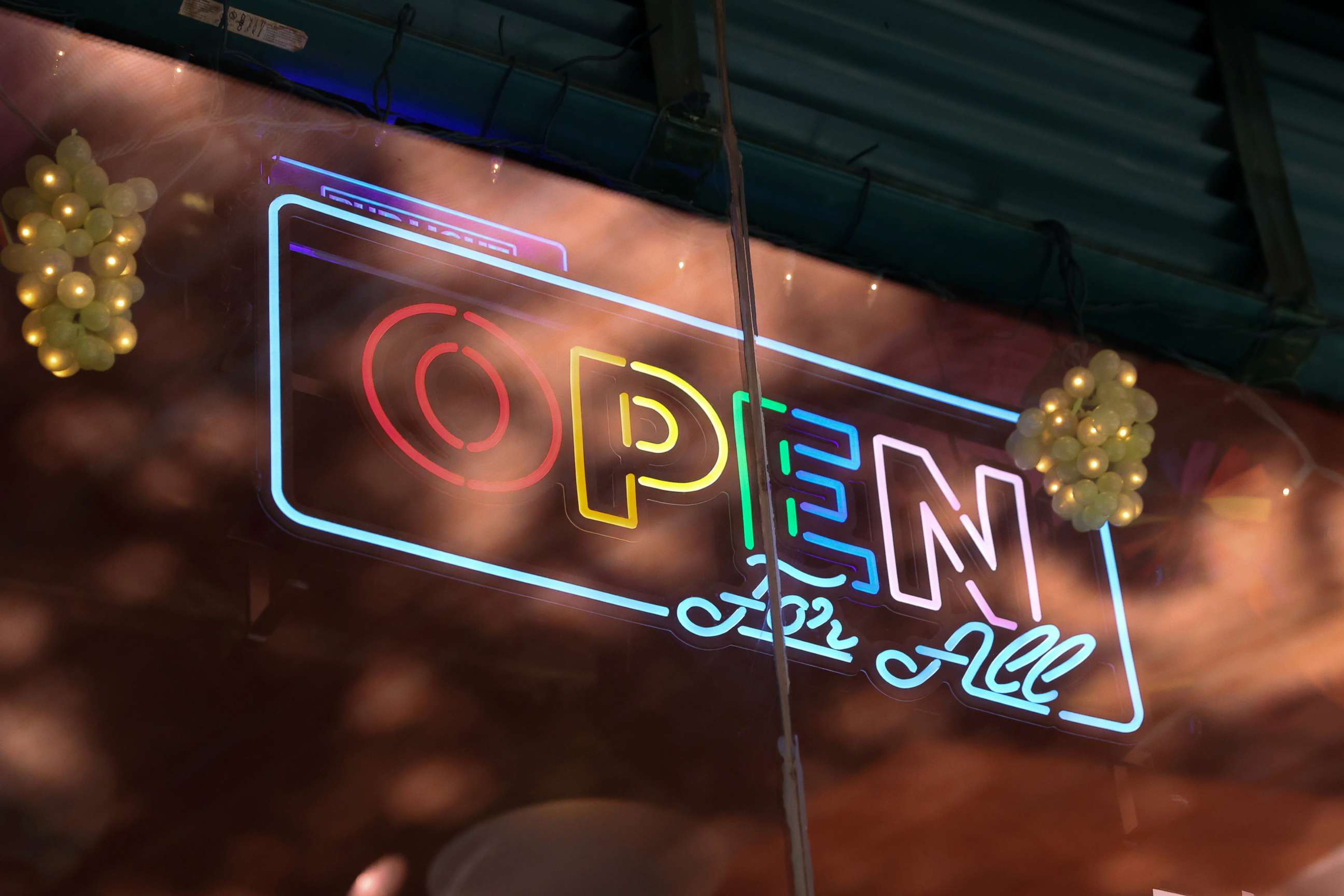 PHOTO: A neon sign hangs in the window of Cubbyhole in the Manhattan borough of New York City, May 27, 2021.