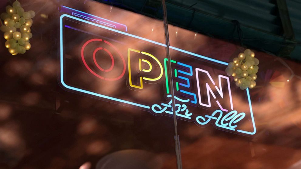 PHOTO: A neon sign hangs in the window of Cubbyhole in the Manhattan borough of New York City, May 27, 2021.