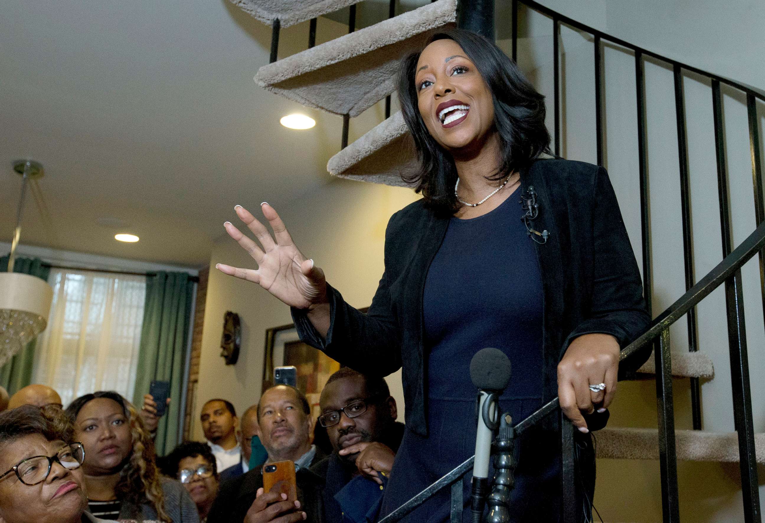 PHOTO: Maya Rockeymoore Cummings speaks to the media and supporters from the stairs of her home announcing her campaign for her late husband's congressional seat, in Baltimore, Nov. 12, 2019.