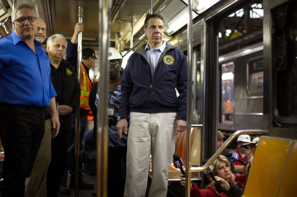 PHOTO: Gov. Andrew Cuomo looks over a train car under repair during a tour of the MTA's 207th St. overhaul shop and train yard on April 6, 2018 in New York.