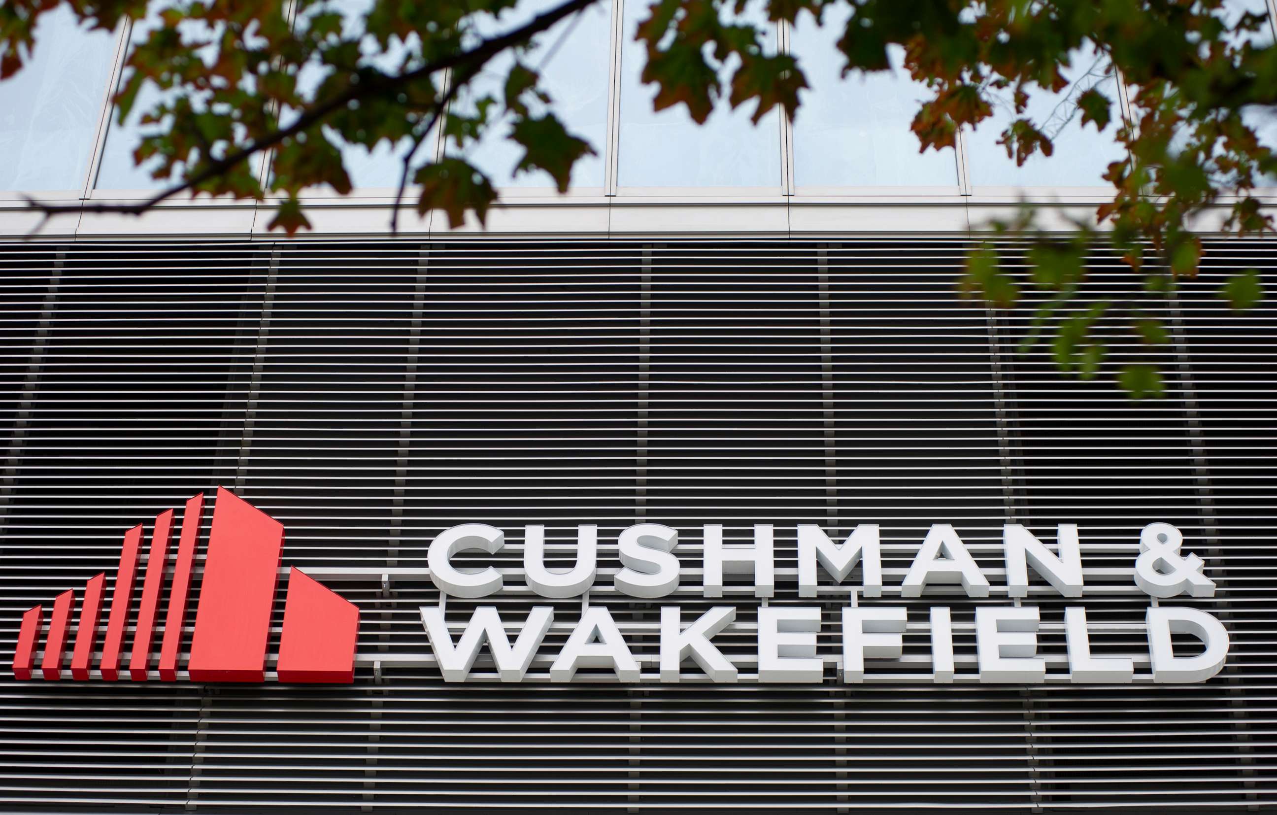 PHOTO: Cushman and Wakefield logo adorns the office complex in Warsaw, Poland, Aug. 23, 2020.