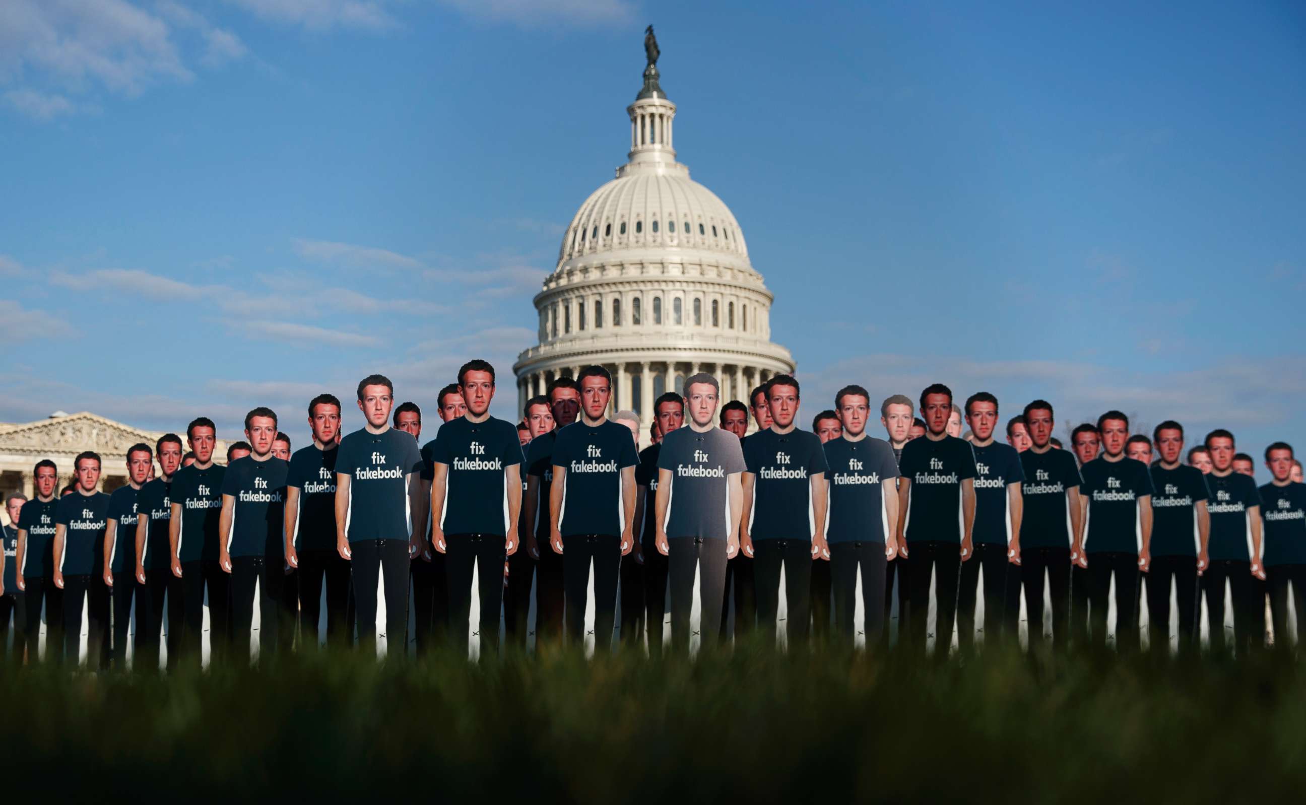 PHOTO: Life-sized cutouts depicting Facebook CEO Mark Zuckerberg wearing "Fix Fakebook" T-shirts are displayed by advocacy group, Avaaz, April 10, 2018, in Washington. 