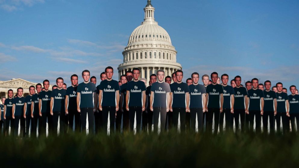 PHOTO: Life-sized cutouts depicting Facebook CEO Mark Zuckerberg wearing "Fix Fakebook" T-shirts are displayed by advocacy group, Avaaz, April 10, 2018, in Washington. 