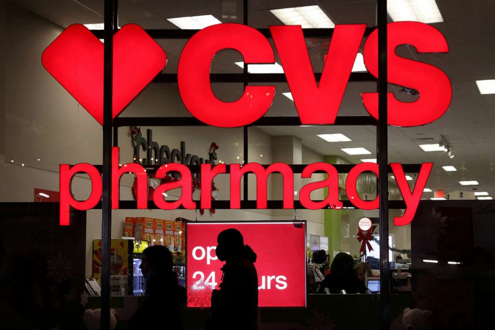 PHOTO: People walk by a CVS pharmacy store in Manhattan, New York City, Nov. 17, 2021.